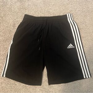 Adidas Black and White Athletic Shorts with Three-Stripe Design